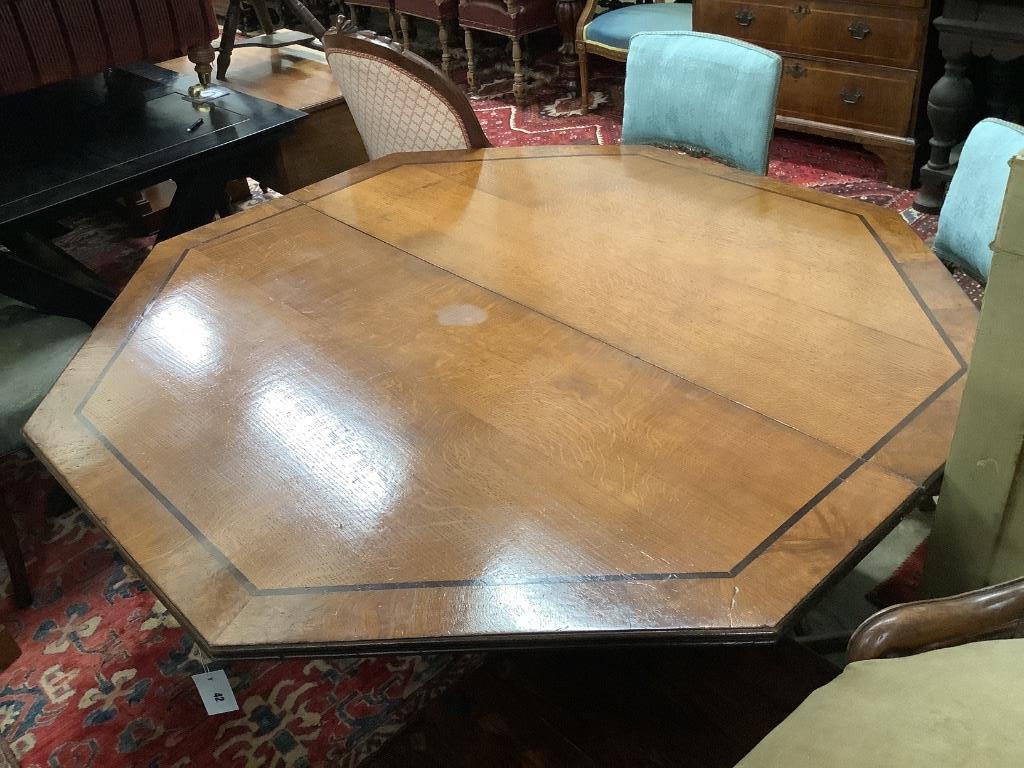 A Regency oak and ebony line inlaid octagonal topped breakfast table, width 138cm, height 72cm